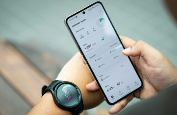 a person holding a smart phone in their hand